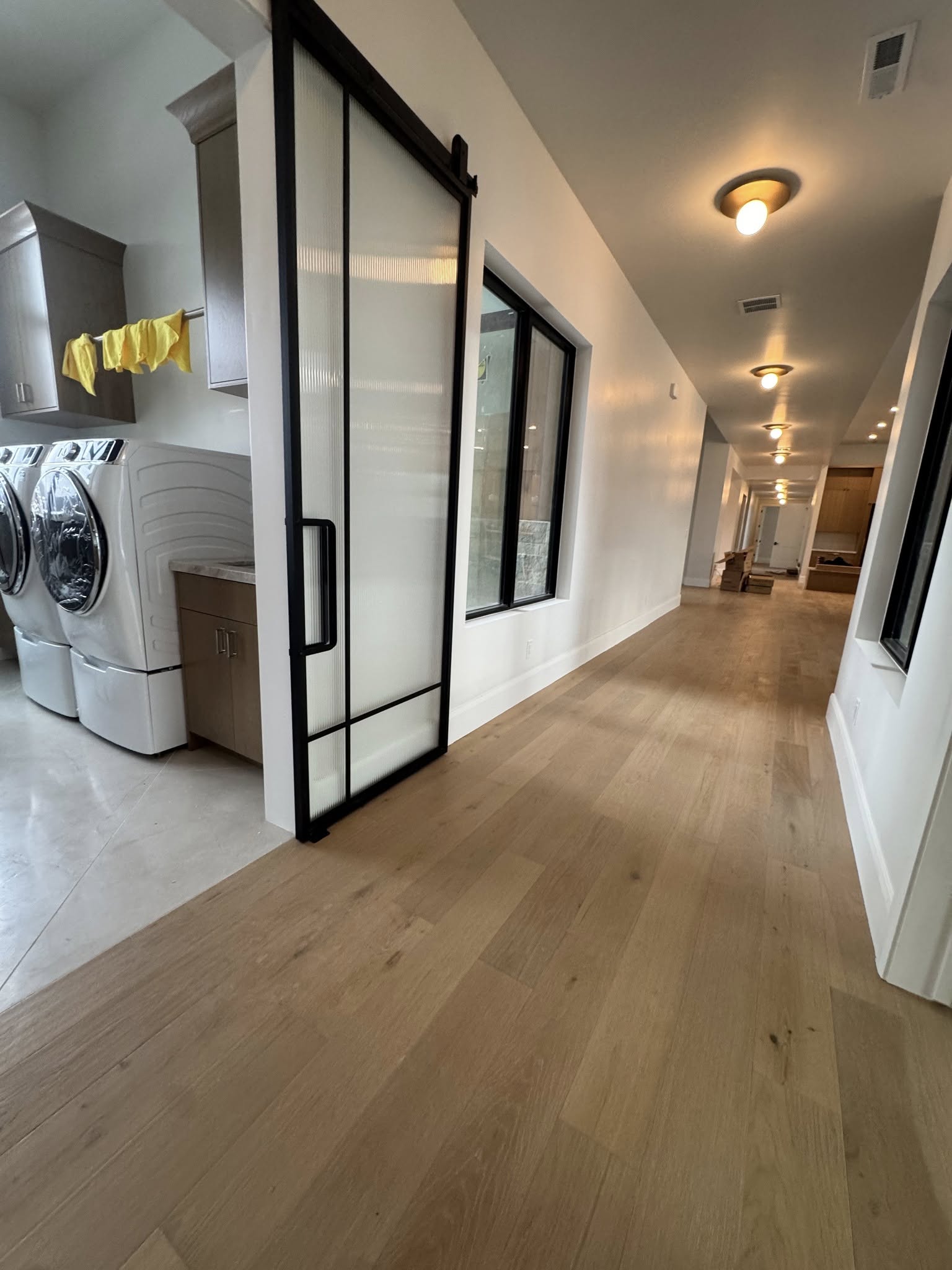Laundry room with sliding door