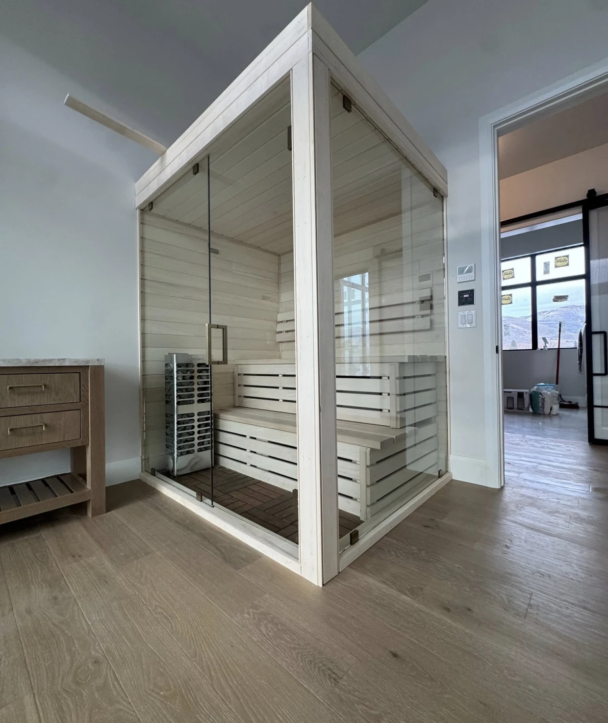 Modern indoor sauna with glass doors